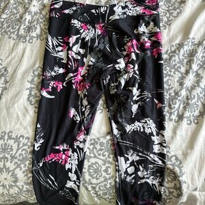 Black and pink floral capri athletic leggings. Asymmetrical band